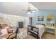 Bedroom with vaulted ceiling, creative wall decor, and comfortable seating area at 2229 S Van Wert S Rd, Villa Rica, GA 30180