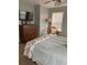 Bedroom with ceiling fan, wood dresser, and a window providing plenty of natural light at 2229 S Van Wert S Rd, Villa Rica, GA 30180