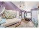 Bedroom with vaulted ceilings, a canopy bed, and bright decorations at 2229 S Van Wert S Rd, Villa Rica, GA 30180