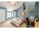 Cozy bedroom with a ceiling fan, punching bag, and a patriotic American flag themed wall decoration at 2229 S Van Wert S Rd, Villa Rica, GA 30180