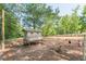 Outdoor chicken coop area featuring a raised coop and plenty of space for chickens to roam at 2229 S Van Wert S Rd, Villa Rica, GA 30180