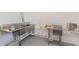 Functional commercial kitchen with multiple stainless steel sinks and plumbing, ideal for food processing at 2229 S Van Wert S Rd, Villa Rica, GA 30180