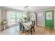 Bright dining room with large windows and a view of the backyard garden at 2229 S Van Wert S Rd, Villa Rica, GA 30180