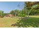 Picturesque barn home surrounded by trees, and a large garden, creating a serene atmosphere at 2229 S Van Wert S Rd, Villa Rica, GA 30180