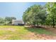 Wide shot of the home showcasing the detached garage, backyard, and ample green space at 2229 S Van Wert S Rd, Villa Rica, GA 30180