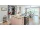 Open kitchen features a granite island with a cooktop and a breakfast nook with backyard views at 2229 S Van Wert S Rd, Villa Rica, GA 30180