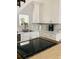 Bright white kitchen with stainless steel appliances and modern countertops at 2229 S Van Wert S Rd, Villa Rica, GA 30180