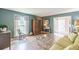 Welcoming living room showcases hardwood floors, soft lighting, and seamless transition to the home's entryway at 2229 S Van Wert S Rd, Villa Rica, GA 30180
