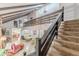 Open-concept living area with exposed beams, staircase, and lots of natural light at 2229 S Van Wert S Rd, Villa Rica, GA 30180