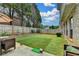 Spacious backyard featuring artificial turf and a tall wooden fence at 2837 Peachstone Ct, Lawrenceville, GA 30043