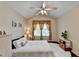 Bright bedroom with vaulted ceiling, decorative window dressings, and hardwood floor at 2837 Peachstone Ct, Lawrenceville, GA 30043