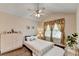 Cozy bedroom with vaulted ceiling, decorative window dressings, and a fluffy rug at 2837 Peachstone Ct, Lawrenceville, GA 30043