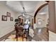 Dining room with dark hardwood floors, modern lighting, and views into other living spaces at 2837 Peachstone Ct, Lawrenceville, GA 30043