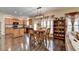 Dining area with a view to the kitchen, wood floors, and plenty of light at 2837 Peachstone Ct, Lawrenceville, GA 30043