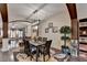 An elegant dining room featuring dark hardwood floors and trim and a modern light fixture at 2837 Peachstone Ct, Lawrenceville, GA 30043
