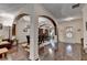 Open-concept dining room with dark hardwood floors and views into other living spaces at 2837 Peachstone Ct, Lawrenceville, GA 30043