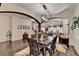 Dining room featuring dark hardwood floors, modern lighting, and a view of other living spaces at 2837 Peachstone Ct, Lawrenceville, GA 30043