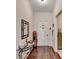 This hallway has wood floors and a mirrored console table at 2837 Peachstone Ct, Lawrenceville, GA 30043