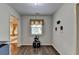 Hallway with hardwood floors and view to the main bedroom through doorway at 2837 Peachstone Ct, Lawrenceville, GA 30043