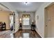 Hallway with wood-style floors, a window and multiple doors at 2837 Peachstone Ct, Lawrenceville, GA 30043