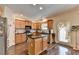 Eat-in kitchen with an island, stainless steel appliances, and hardwood floors at 2837 Peachstone Ct, Lawrenceville, GA 30043
