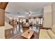 Spacious living area with fireplace, wood floors, and access to dining and kitchen at 2837 Peachstone Ct, Lawrenceville, GA 30043