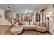 Cozy living room featuring a large sofa and seamless connection to the kitchen area at 2837 Peachstone Ct, Lawrenceville, GA 30043