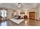 Spacious main bedroom boasts a tray ceiling and hardwood floors at 2837 Peachstone Ct, Lawrenceville, GA 30043