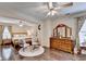 Spacious main bedroom featuring hardwood floors, sitting area, and large wooden dresser at 2837 Peachstone Ct, Lawrenceville, GA 30043