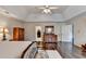 Inviting main bedroom boasting a tray ceiling and shiny hardwood floors at 2837 Peachstone Ct, Lawrenceville, GA 30043