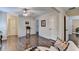 Spacious bedroom with hardwood floors, white walls, and multiple doors at 2837 Peachstone Ct, Lawrenceville, GA 30043
