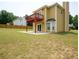 Spacious backyard with a deck, patio, and lush green lawn, perfect for outdoor activities at 2928 Riverset Ct, Decatur, GA 30034