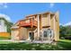 Two story home featuring a spacious backyard with a wooden deck at 2928 Riverset Ct, Decatur, GA 30034