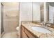 Bathroom showcasing granite countertop, tiled flooring, and glass shower at 2928 Riverset Ct, Decatur, GA 30034