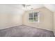Bedroom with carpet, ceiling fan, a window with blinds overlooking a yard at 2928 Riverset Ct, Decatur, GA 30034