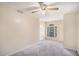 Bedroom with ceiling fan, plush carpet, a window with blinds, and neutral colored walls at 2928 Riverset Ct, Decatur, GA 30034