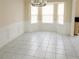 Cozy dining area with wainscoting, a bay window, and a chandelier at 2928 Riverset Ct, Decatur, GA 30034