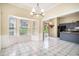 Dining area with a bay window, tile flooring, and access to the kitchen with granite countertops at 2928 Riverset Ct, Decatur, GA 30034