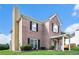 Two-story brick home showcasing green lawn, black shutters, and a covered front entryway at 2928 Riverset Ct, Decatur, GA 30034