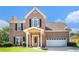 Beautiful brick home with covered entry, two-car garage, and manicured front lawn at 2928 Riverset Ct, Decatur, GA 30034