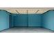 A freshly painted two car garage with an epoxy floor and automatic door opener at 2928 Riverset Ct, Decatur, GA 30034
