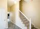 Inviting hallway featuring stylish tile flooring and a staircase with white railings at 2928 Riverset Ct, Decatur, GA 30034