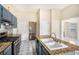 Kitchen showcasing granite countertops, tile floors, stainless steel appliances and natural light at 2928 Riverset Ct, Decatur, GA 30034