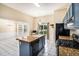 Bright kitchen with tile floors, granite countertops, stainless steel appliances, and center island at 2928 Riverset Ct, Decatur, GA 30034
