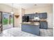 Open kitchen features an island, granite countertops, stainless steel appliances, and sliding door access to backyard at 2928 Riverset Ct, Decatur, GA 30034