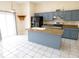 Modern kitchen with an island, granite countertops, stainless steel appliances, and ample cabinet space at 2928 Riverset Ct, Decatur, GA 30034