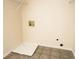 Neutral laundry room featuring a utility sink, tile floor, and white trim at 2928 Riverset Ct, Decatur, GA 30034
