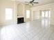 Bright living room with high ceilings, a fireplace, and large windows offering plenty of natural light at 2928 Riverset Ct, Decatur, GA 30034
