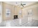 Bright living room with fireplace, tile flooring, neutral walls and a ceiling fan at 2928 Riverset Ct, Decatur, GA 30034