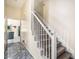 Entryway featuring staircase with carpeted steps and tile flooring leading to kitchen and living area at 2928 Riverset Ct, Decatur, GA 30034